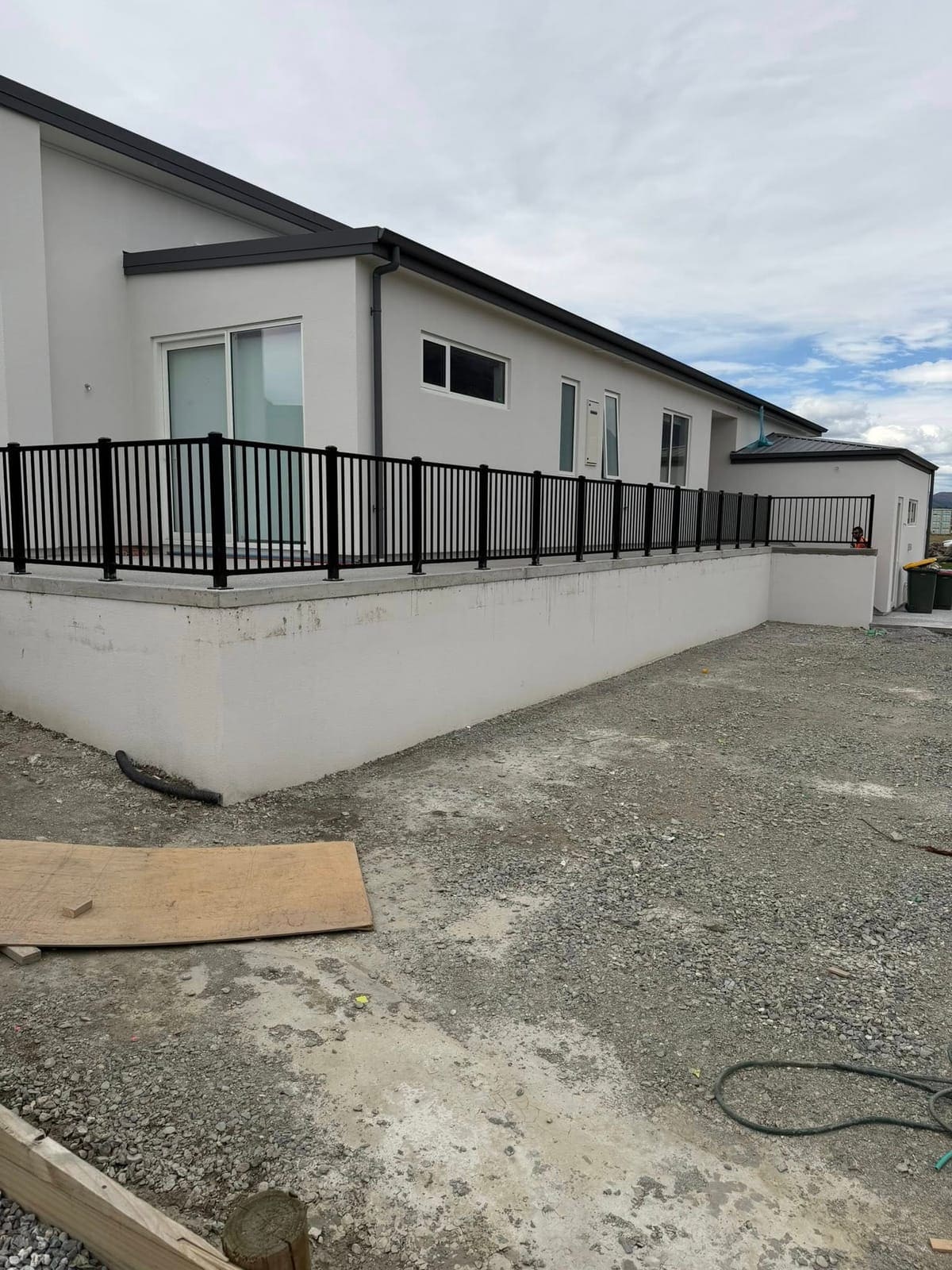 Black tubular steel balustrade along a raised deck, Queenstown