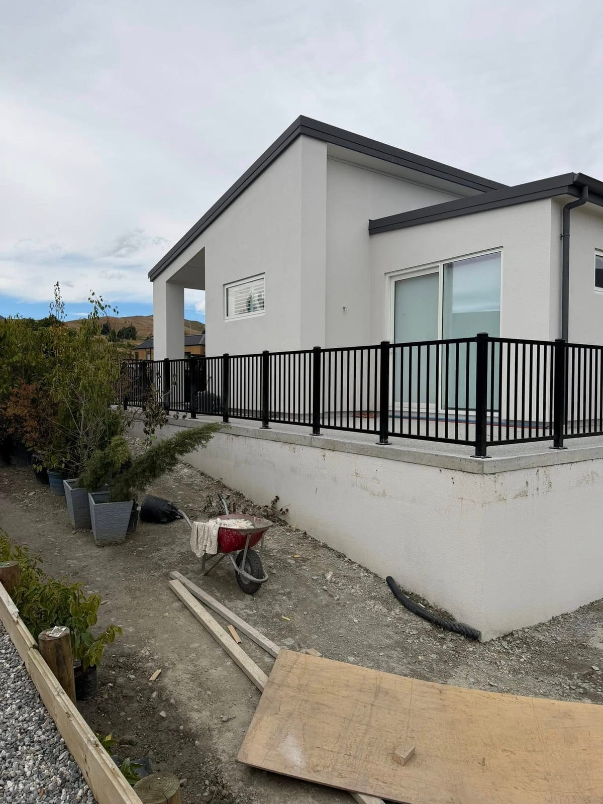 Black tubular steel balustrade with mountain views, Queenstown