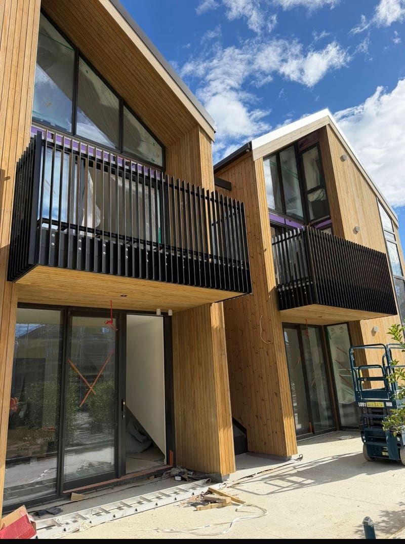 Black balustrade on a multi-level deck with cedar cladding, Queenstown