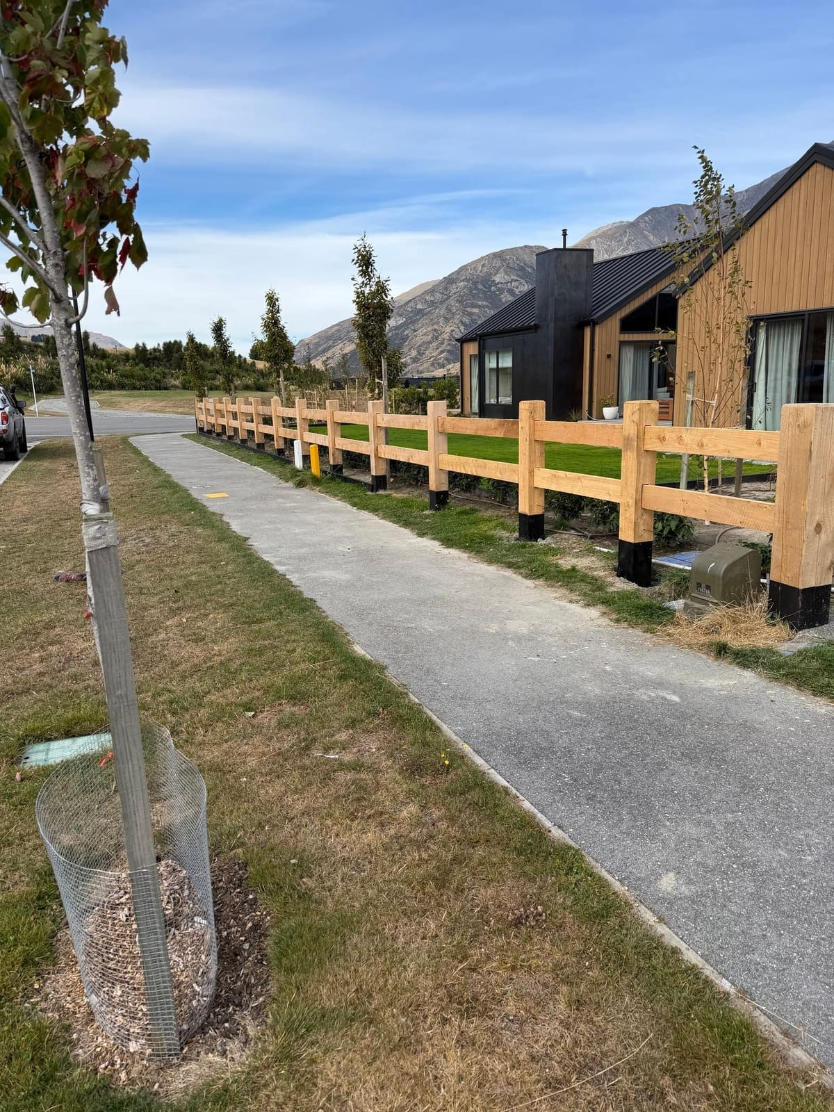Macrocarpa post and rail fencing with The Remarkables behind, Hanley's Farm