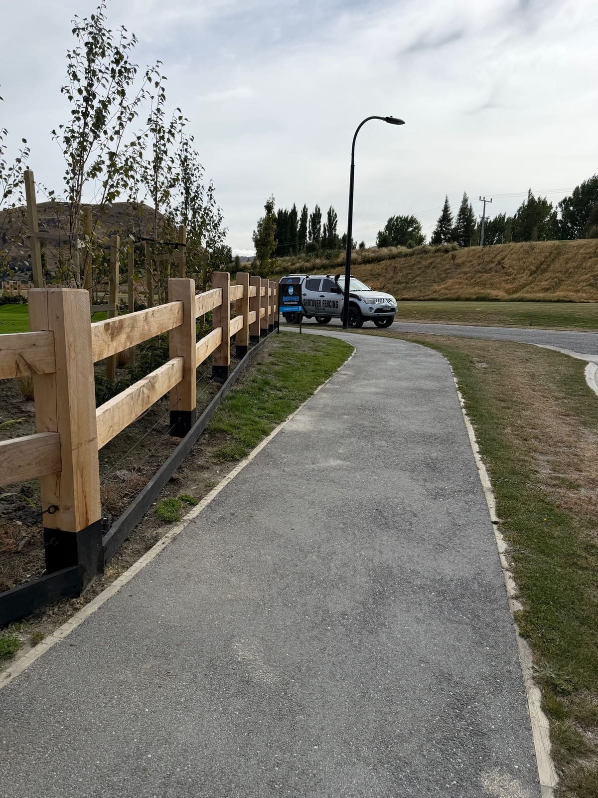 Macrocarpa fencing along a path at Hanley's Farm, Queenstown
