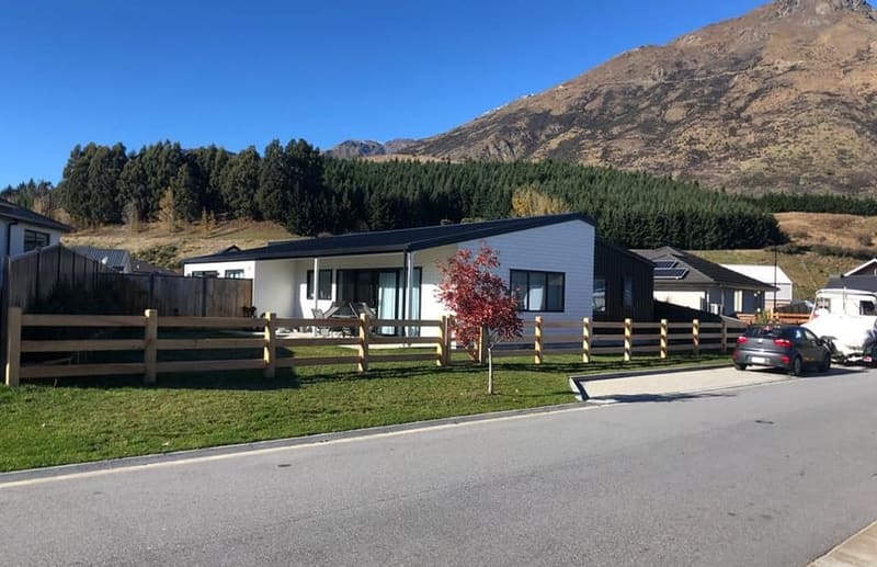 Macrocarpa post and rail fencing along a street in the Hanley's Farm subdivision, Queenstown