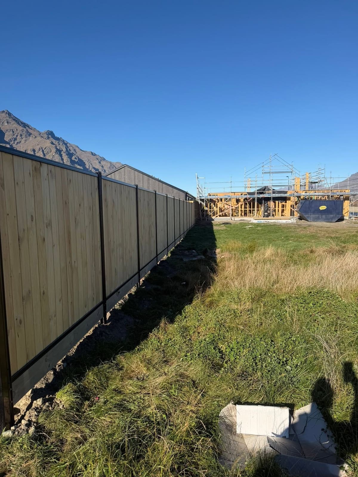 Smart wall boundary fence running alongside a Parkridge new build, Queenstown