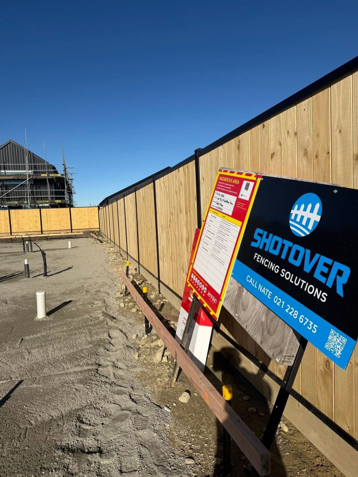 Smart wall boundary fence at Parkridge with Shotover Fencing Solutions signage, Queenstown