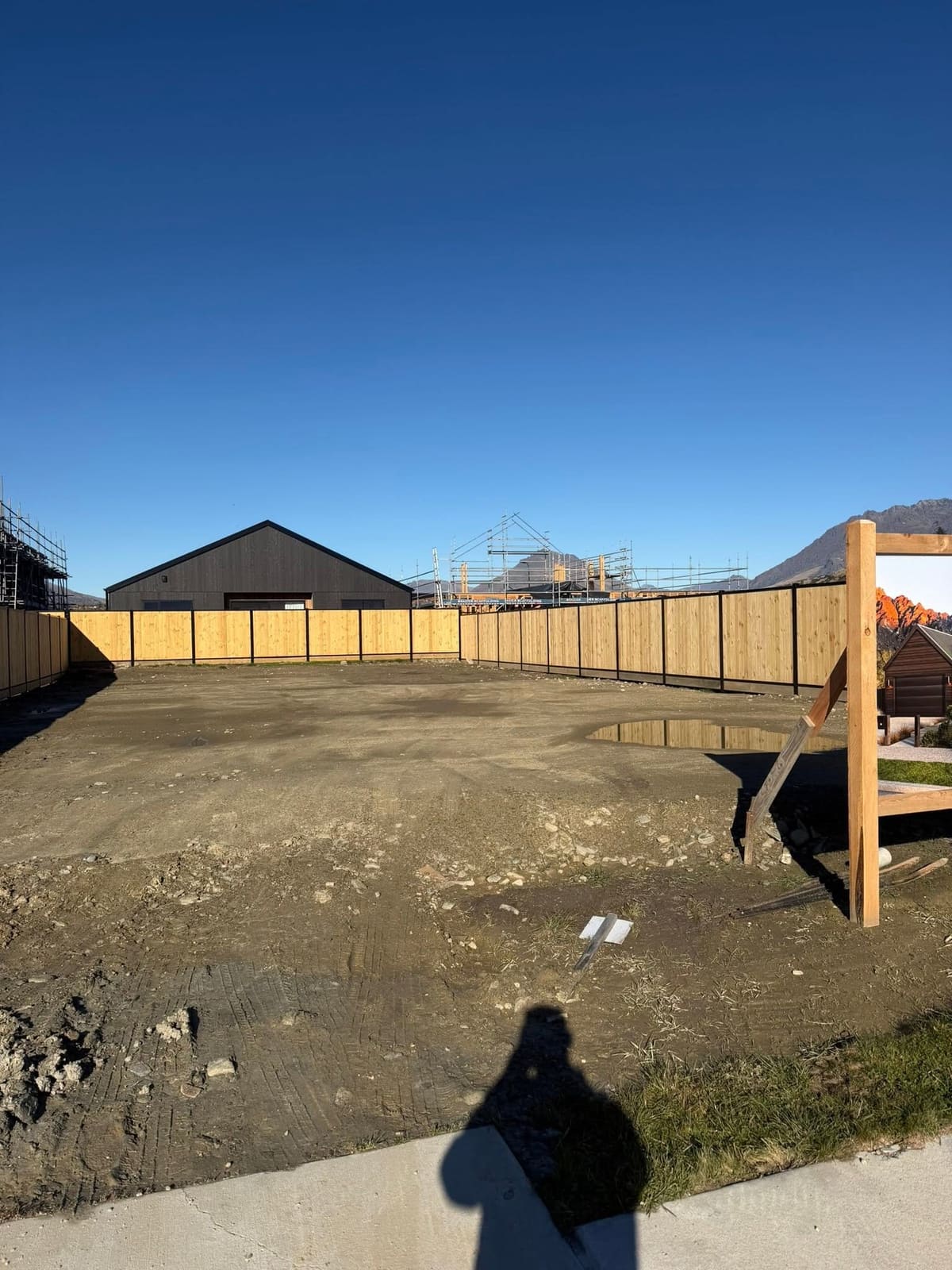 Smart wall fencing around a Parkridge section under construction, Queenstown