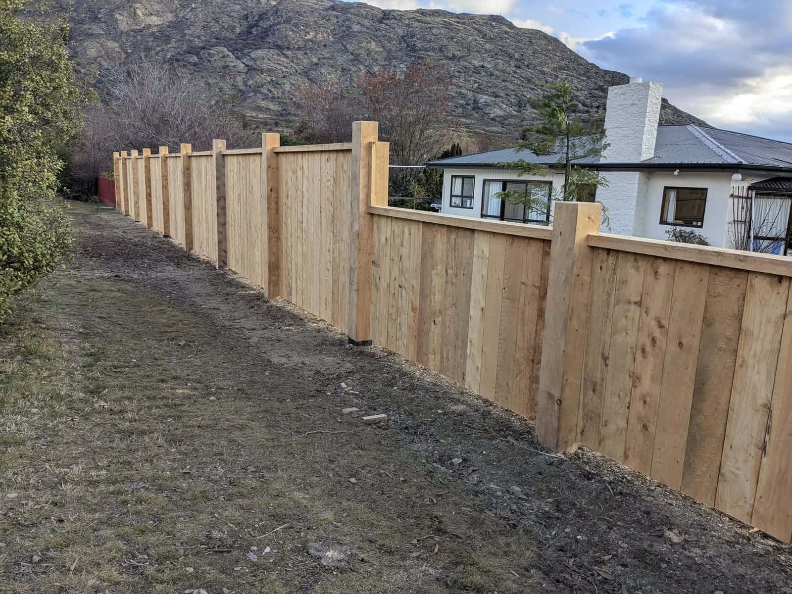 Timber paling fence along a section boundary, Queenstown