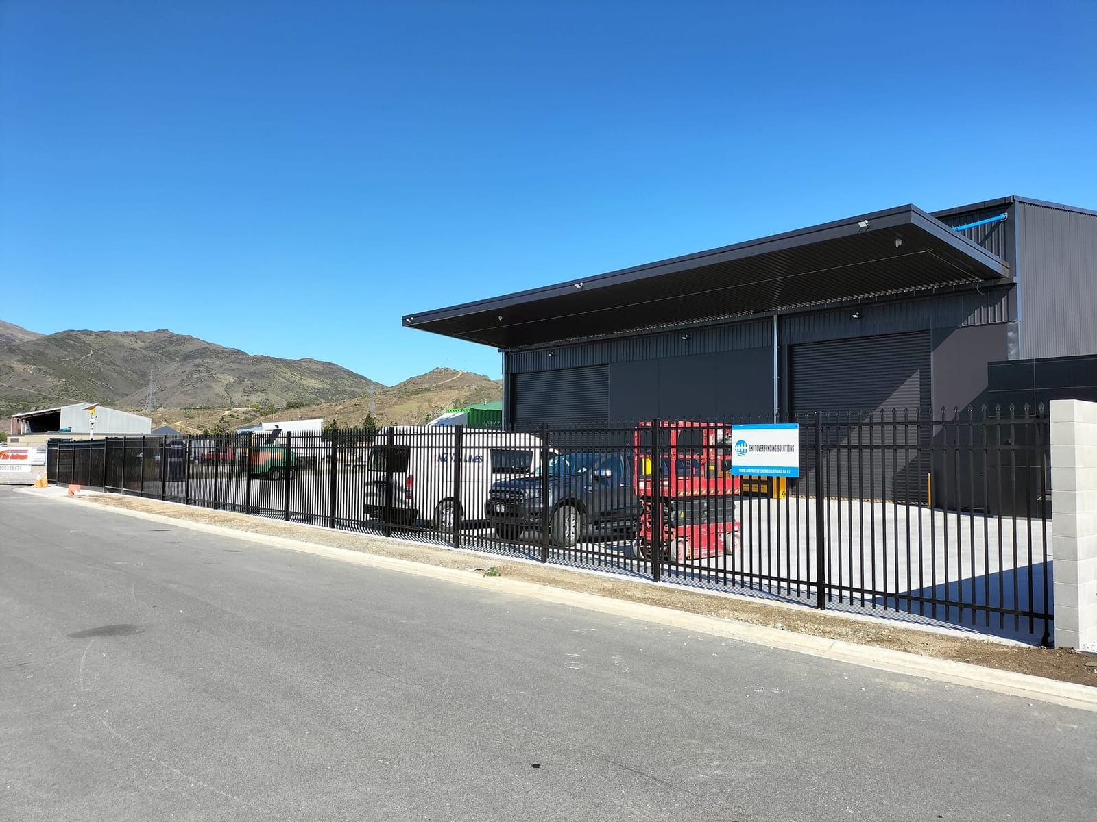 Black tubular steel fencing at a commercial site in Queenstown