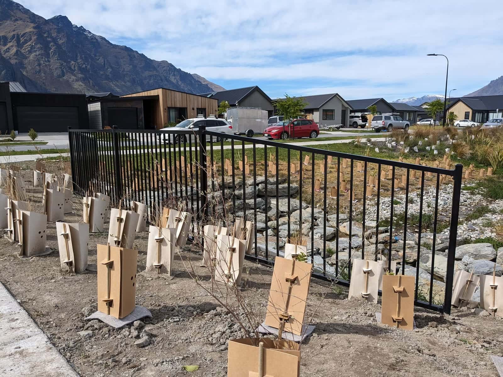 Black tubular steel fencing on a new subdivision, Queenstown
