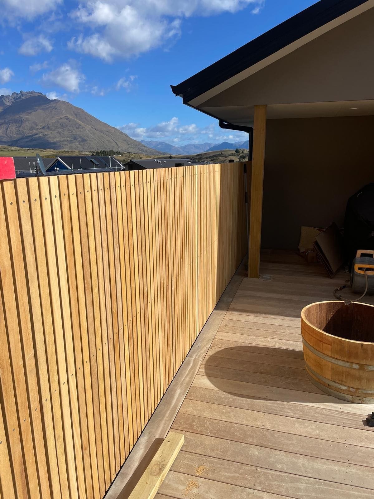 Cedar horizontal slat fence enclosing a private outdoor area, Queenstown