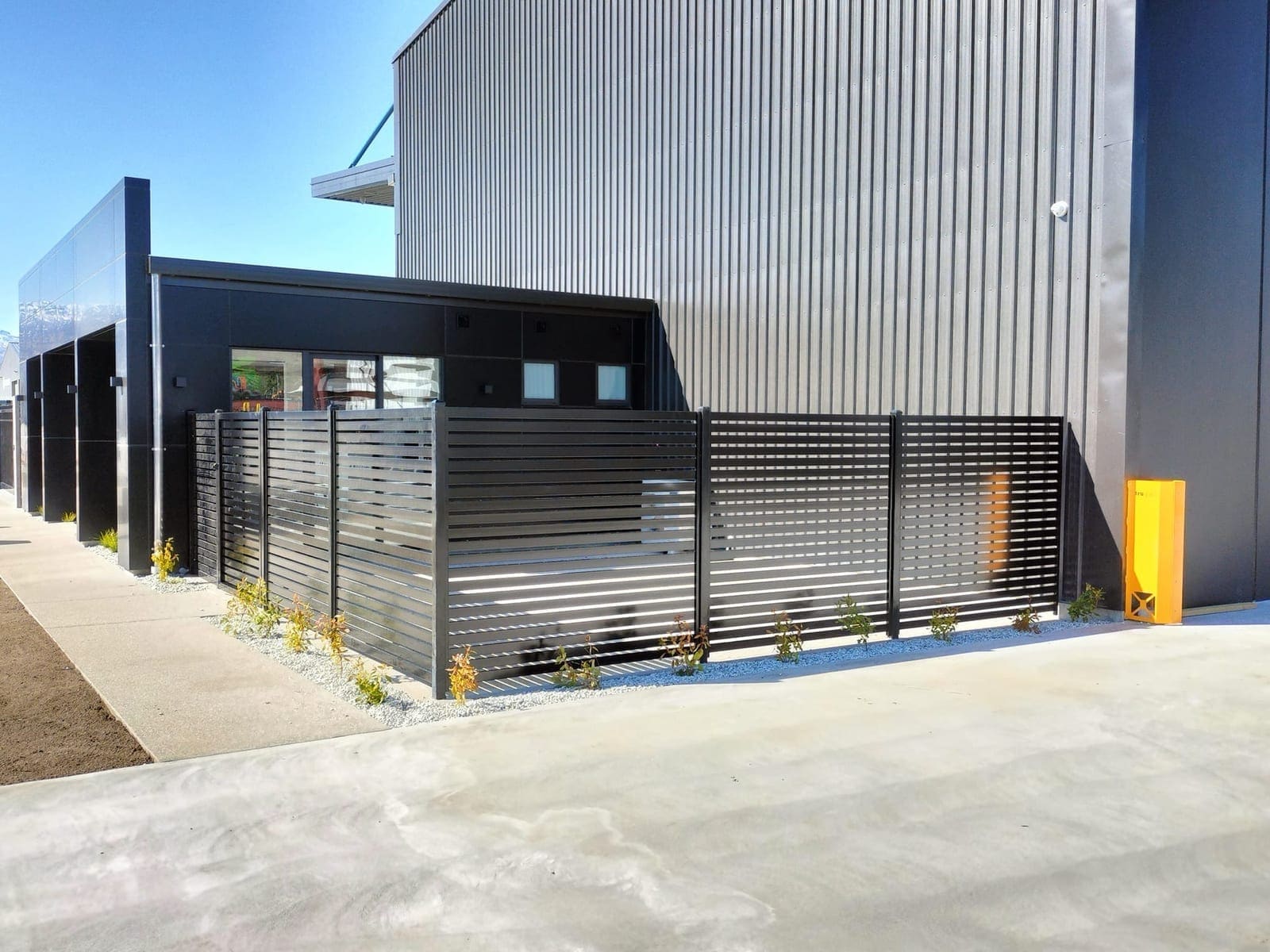 Smart Wall fencing and matching gate at a Queenstown property